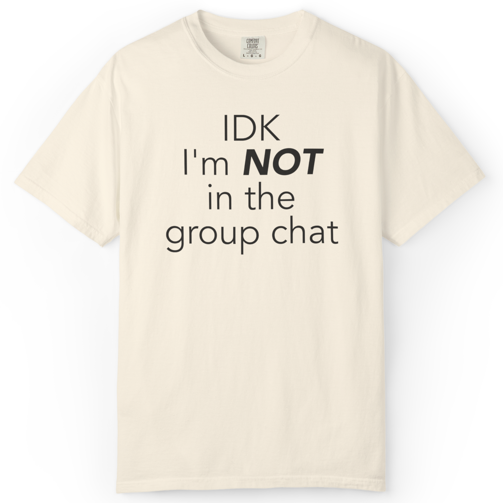 Neutral aesthetic graphic tee with relatable “not in the group chat” phrase