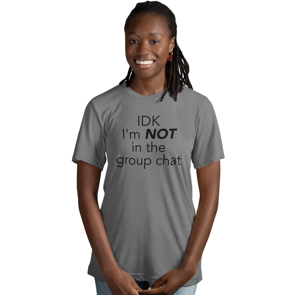 Casual outfit featuring “not in the group chat” graphic tee styled with jeans